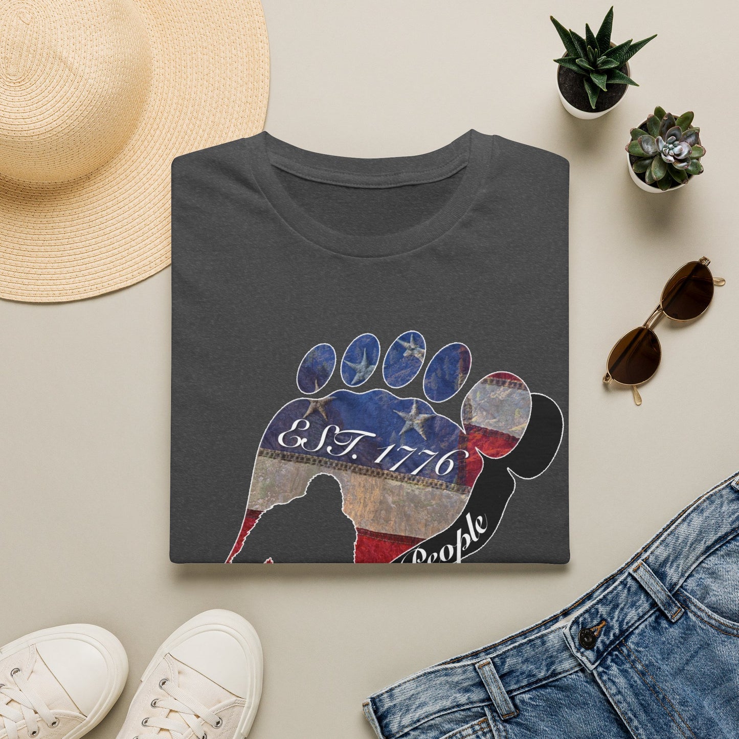 Going Norther Bigfoot T-Shirt — Footprint Silhouette with Distressed Flag "EST. 1776 - We The People"