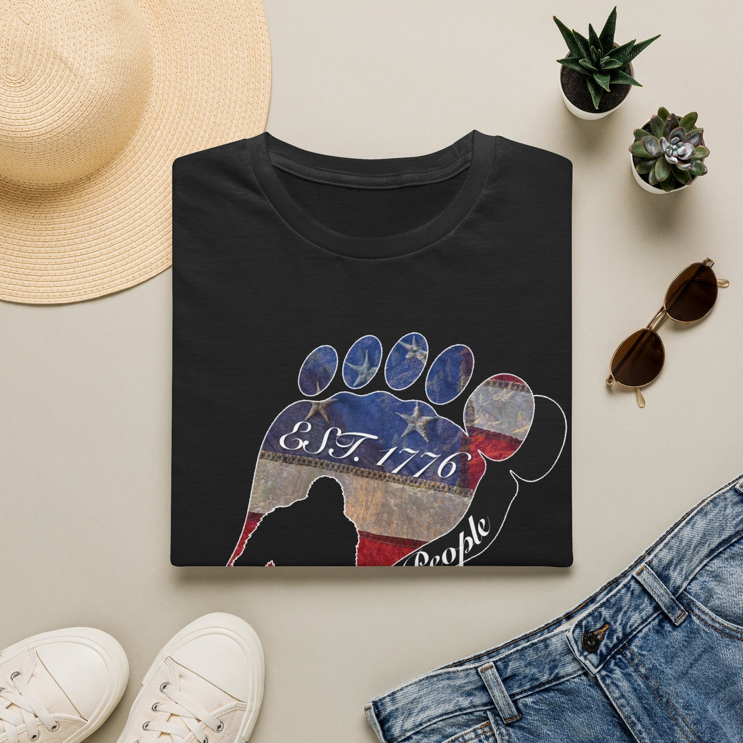 Going Norther Bigfoot T-Shirt — Footprint Silhouette with Distressed Flag "EST. 1776 - We The People"