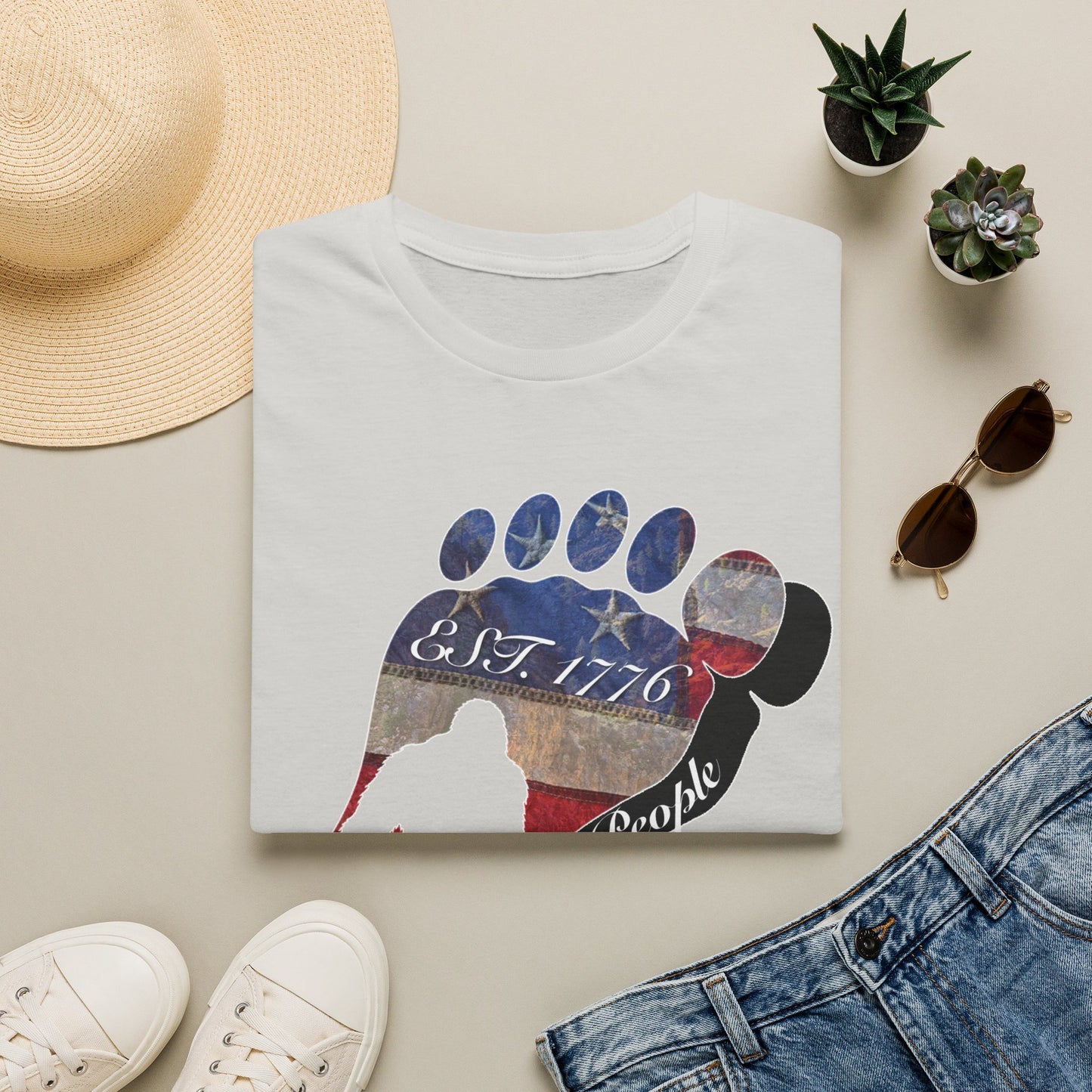 Going Norther Bigfoot T-Shirt — Footprint Silhouette with Distressed Flag "EST. 1776 - We The People"