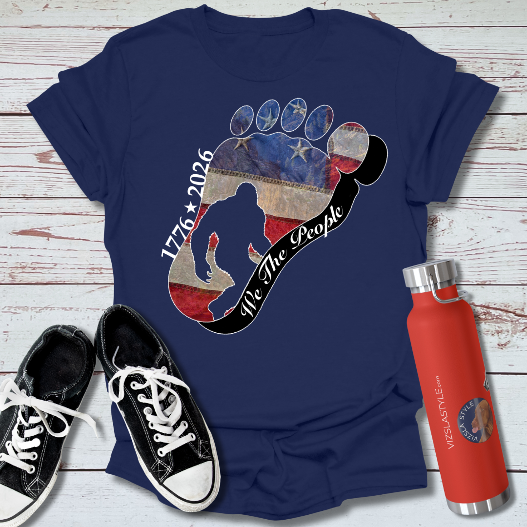 Going Norther Bigfoot T-Shirt — Footprint Silhouette with Distressed Flag & "1776 - 2026 - We The People"